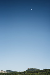 Mountains on the blue clear sky background. Gradient blue sky. Mountain hike 