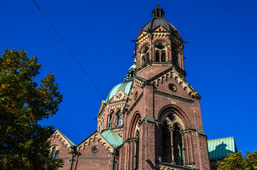 Fototapeta na wymiar St Luke Church located on the Isar river banks, and it is the largest Protestant church in Munich, Germany