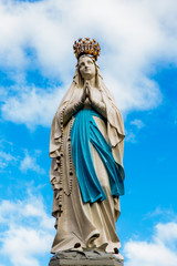 Statue of Our Lady in front of the sky