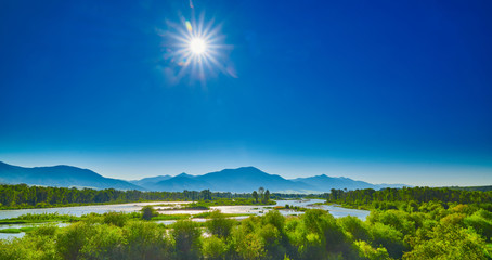 Snake River with blue skies and  the morning sun. © Patrick Jennings