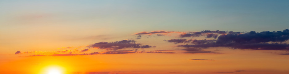 Panorama of picturesque sky with clouds during sunset