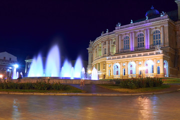 Fototapeta na wymiar night view of Opera house in Odessa city, Ukraine. Beautiful city Park and street illumination