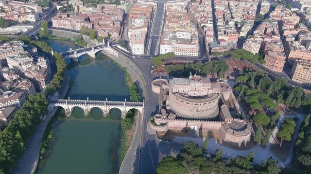 Aerial view of Castel Sant'Angelo (Castle of the Holy Angel), iconic mausoleum/fortress in Rome, bridge over river Tiber - cityscape panorama of capital city of Italy from above, Europe