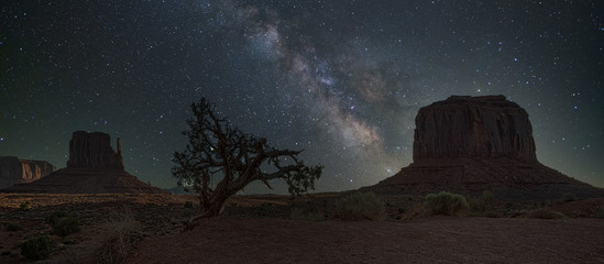starry night sky over the monument valley - Powered by Adobe