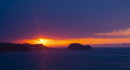 Naklejka na ściany i meble Island of San Anton and Cantabrian Sea at sunset in Getaria, Basque Country