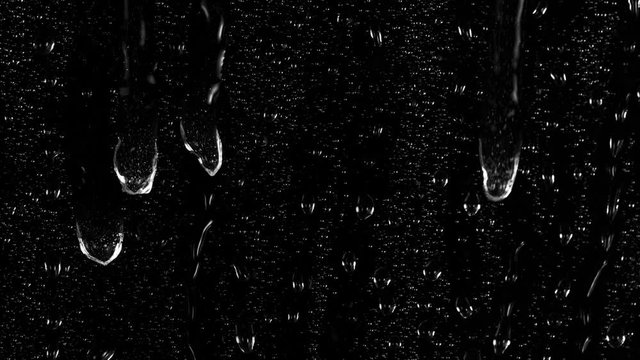 Super Slow Motion Shot of Water Drops Flowing on Transparent Glass at 1000 fps.