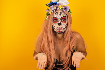 Puzzled and clueless young woman with arms out, shrugging her shoulders, saying: who cares, so what, I don't know. Negative human emotions, facial expressions, life perception and attitude.