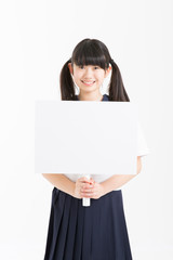 Fototapeta premium プラカードを持つ女子中学生