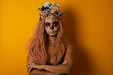 Picture of angry young beautiful woman standing isolated over bright background. Looking camera.