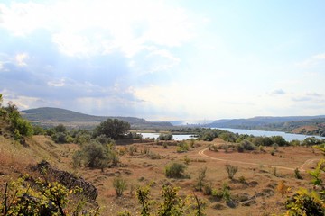 View from the height of the meadow and lake in the vicinity of the village of Strashimirovo (Bulgaria)