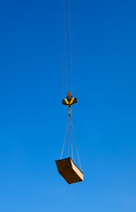 Cargo hoisted by ropes to the sky