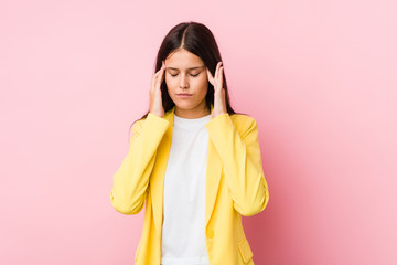 Young business woman touching temples and having headache.