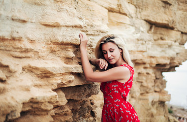 
portrait of a blonde near the rocks