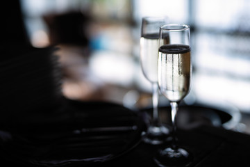 selective focus, two glasses of cold white wine in  dark room