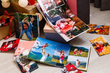 Fototapeta premium family photo album near the Christmas tree