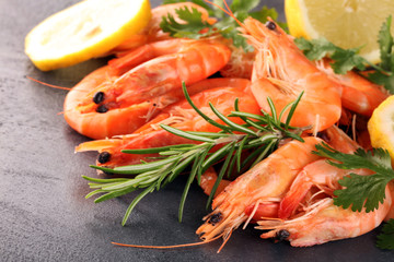 Raw fresh Prawns Langostino Austral. shrimp seafood with fresh lemon and spices.