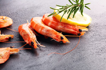 Raw fresh Prawns Langostino Austral. shrimp seafood with fresh lemon and spices.