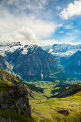 View of the Grindelwald valley in the alps mountains above the village of Grindelwald, Switzerland.