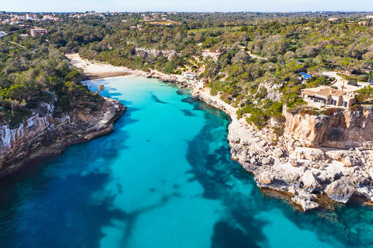 Spain, Mallorca, Santanyi, Drone view of Cala Llombards bay