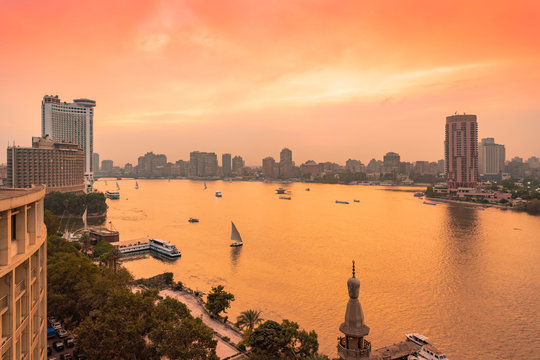 Egypt, Cairo, Nile with skyline and downtown area from Garden City at sunset