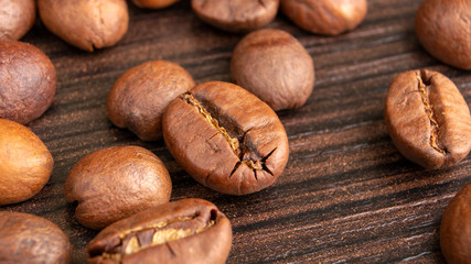Roasted Coffee beans background close up. International coffee day concept. Texture for design.