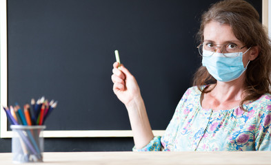 teacher wearing face mask back to school during covid pandemics