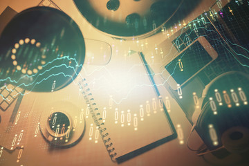 Multi exposure of forex chart drawing and work table top veiw. Concept of financial analysis.