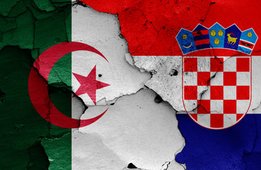 flags of Algeria and Croatia painted on cracked wall