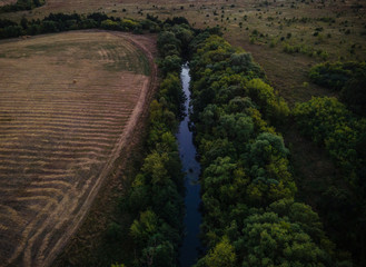 green forests in a Russian village in summer.aerial photography of the river