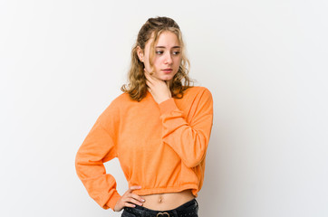 Young caucasian woman on white backrgound suffers pain in throat due a virus or infection.