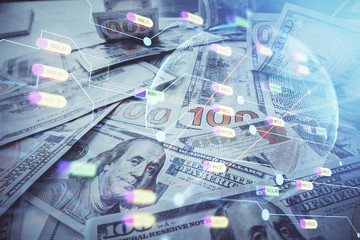 Double exposure of world map drawing over us dollars bill background. International concept.