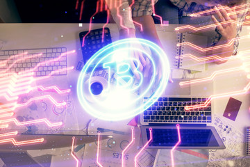 Obraz premium Double exposure of man and woman working together and crypto theme hologram drawing. Computer background. Blockchain concept. Top View.
