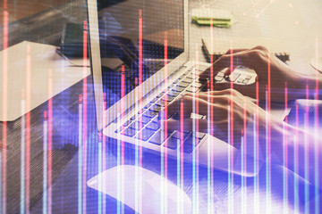 Double exposure of woman hands typing on computer and forex chart hologram drawing. Stock market invest concept.