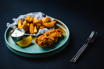 Fried chicken with sesame and potatoes