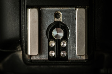 Macro shot of the camera shoe for the flashlight to attach