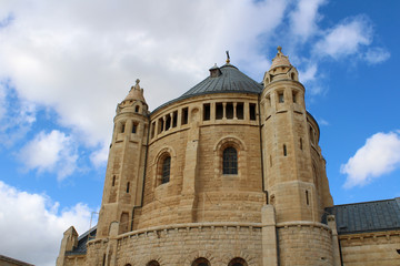 Fototapeta na wymiar Dormition Abbey under cloudy sky near Old Jerusalem