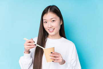 Young japanese woman eating noodles