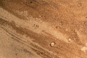 Blended sand and dirt with water droplets