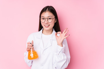 Young chinese scientific woman isolated cheerful and confident showing ok gesture.