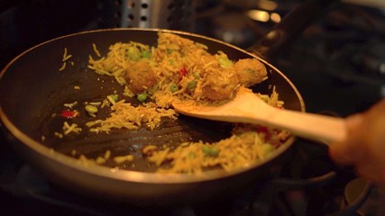 A close up on the Arabic dish Pilaf cooking in a pan