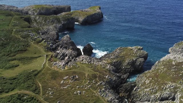 Asturias. Beautiful cliffs landscape. Guadamia beach. Pria blowholes. Spain. Aerial Drone Footage