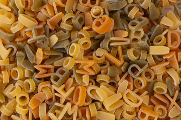 colored pasta in the shape of letters of the alphabet