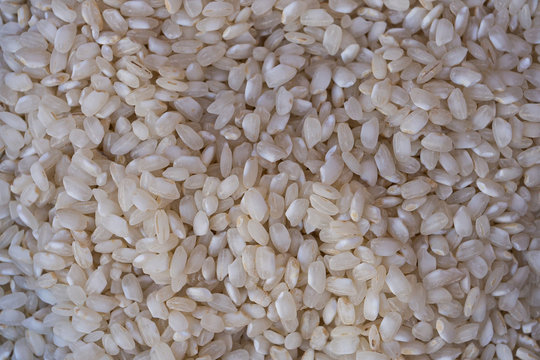 handful of raw white rice for cooking