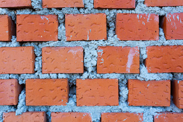 Obraz premium red brick structure with gray cement arranged in a linear fashion