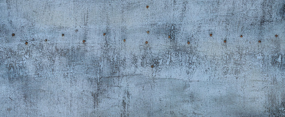 Aged cracked paint on metal surface. Banner..Old painted metal textured background. Grey blue grunge background.