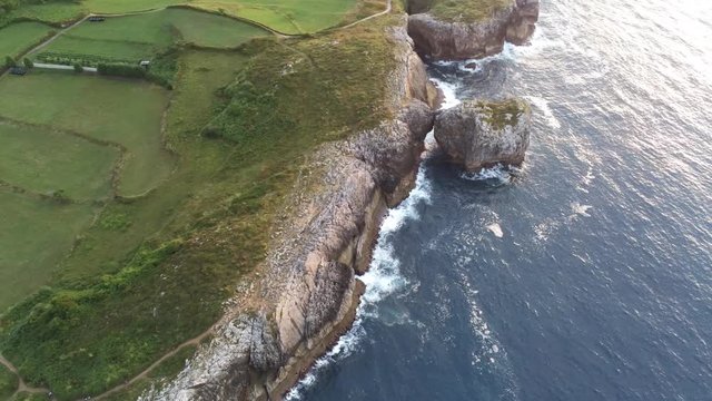 Asturias. Beautiful landscape in the coastal area of Gulpiyuri beach. Spain. Aerial Drone Footage
