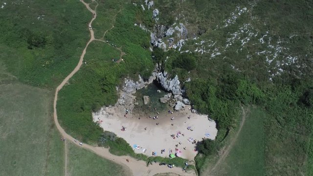 Asturias. Beautiful landscape in the coastal area of Gulpiyuri beach. Spain. Aerial Drone Footage
