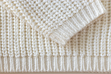 White knitted wool texture background.