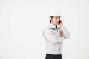 ビジネスマン　作業服　電話　トラブル