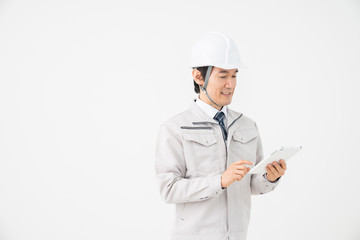 ビジネスマン　作業服　タブレット